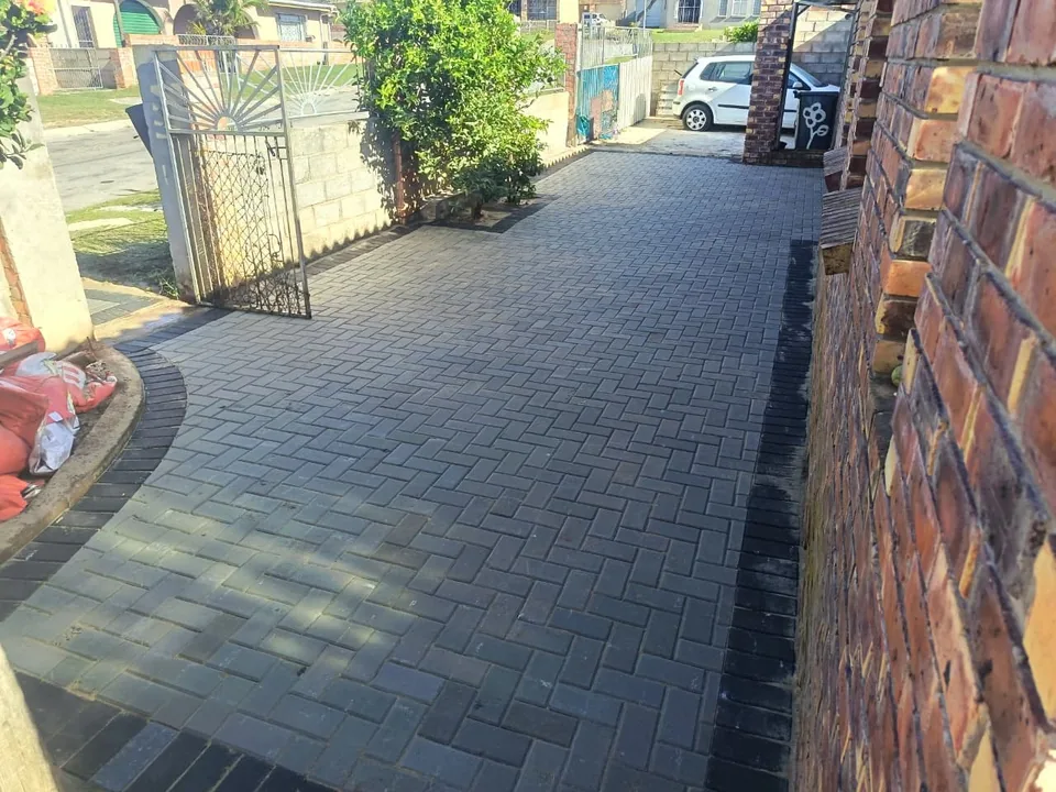 Completed charcoal herringbone residential driveway
