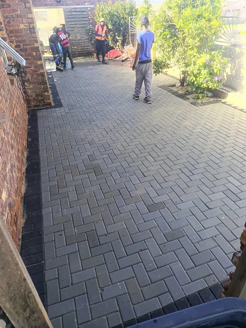 Wide view of completed charcoal driveway