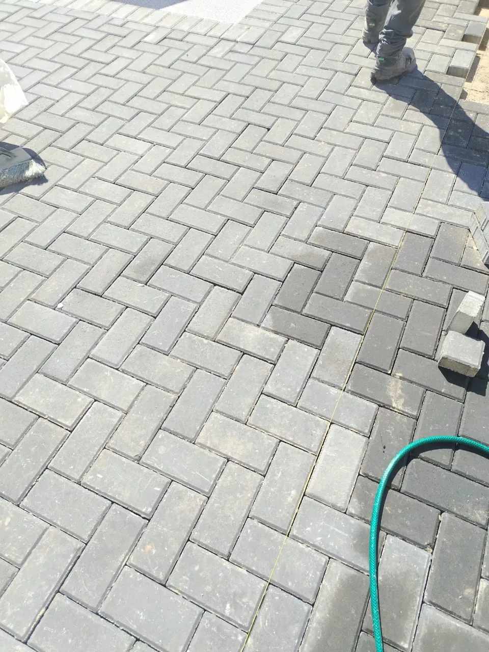 Herringbone paving pattern close-up Gqeberha