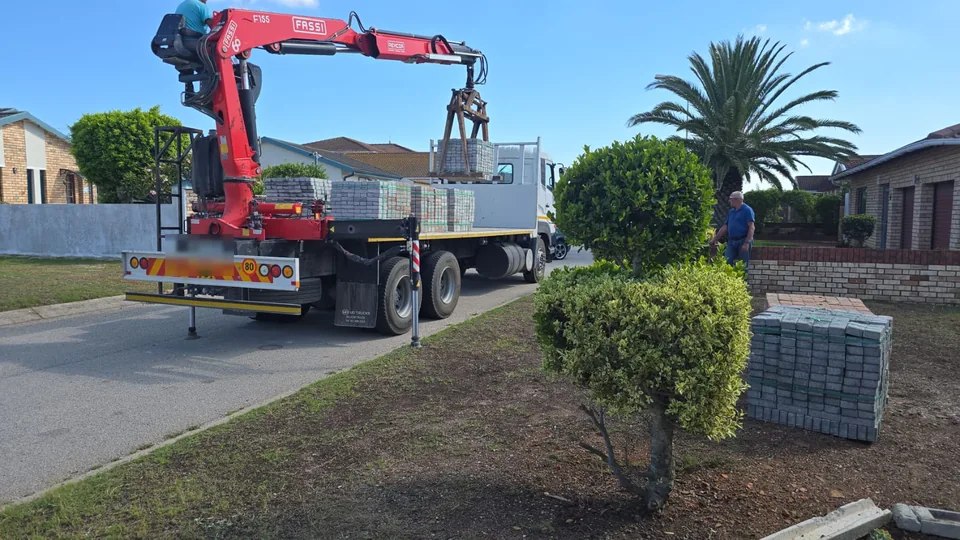 Paving material crane delivery