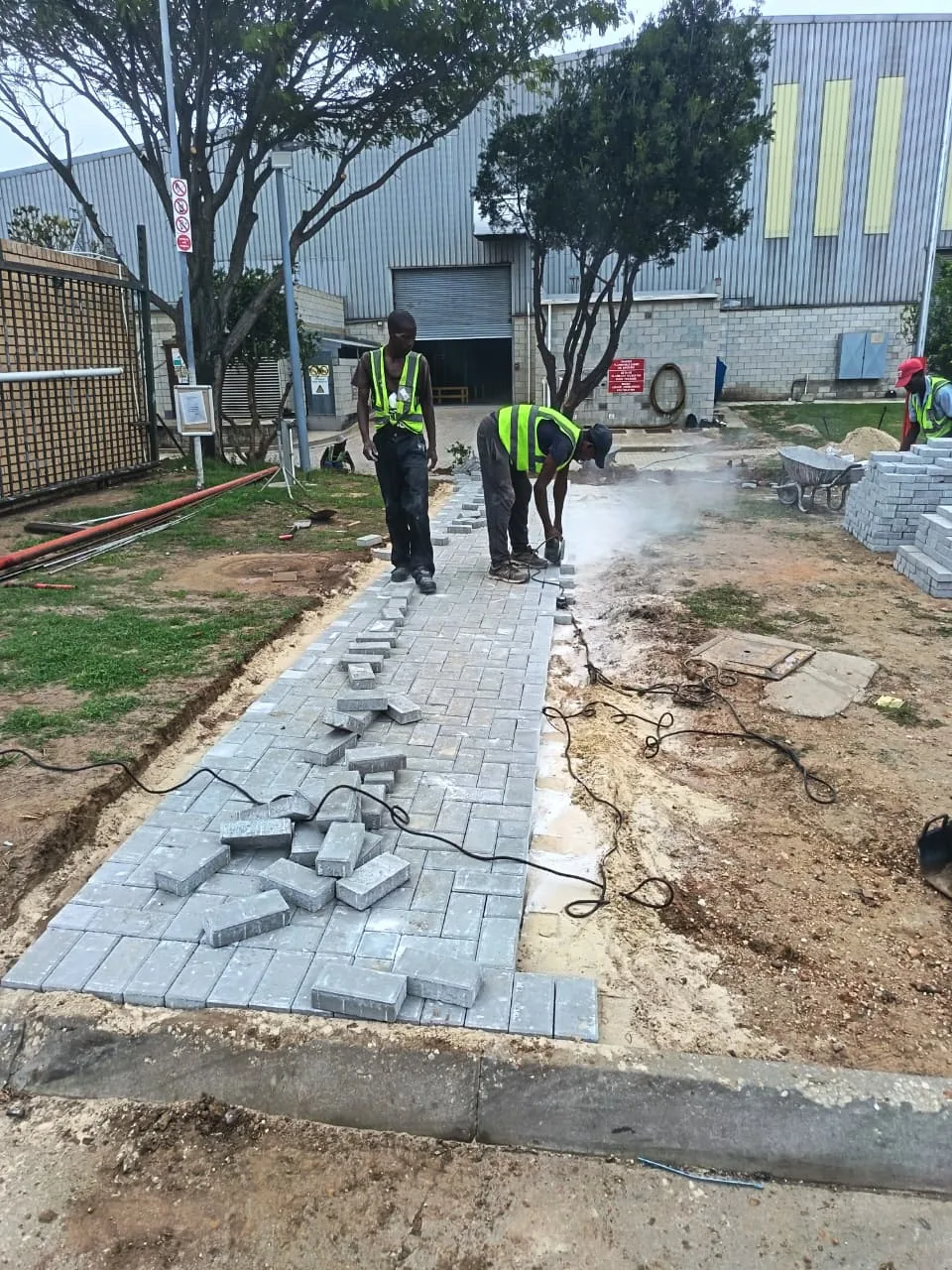 Paving team laying pavers in Gqeberha